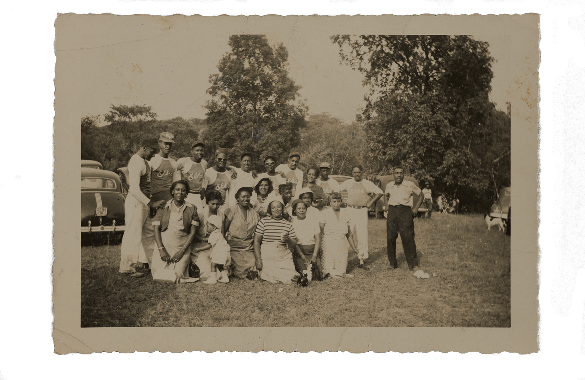 sepia tinted group photo of baseball players and friends